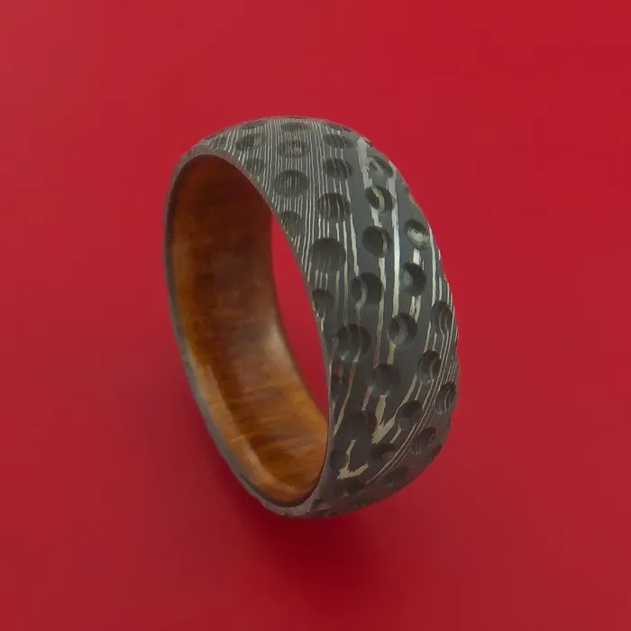 Damascus Steel Ring with Milled Golf Ball Dimple Inlay and Interior Hardwood Sleeve Custom Made Band Lashbrook Rings Damascus Steel Ring with Milled Golf Ball Dimple Inlay and Interior Hardwood Sleeve Custom Made Band Lashbrook Rings