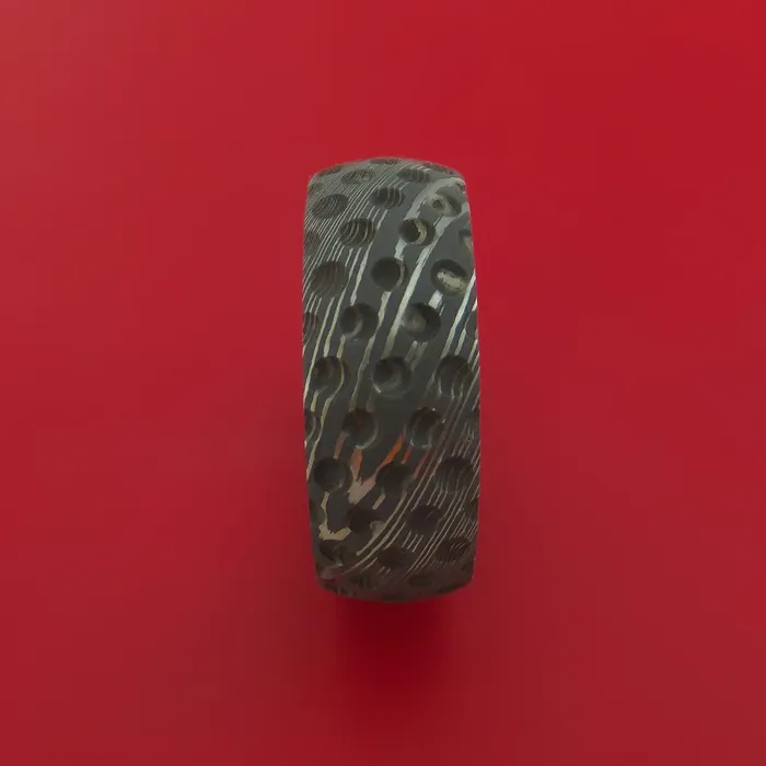 Damascus Steel Ring with Milled Golf Ball Dimple Inlay and Interior Hardwood Sleeve Custom Made Band Lashbrook Rings Damascus Steel Ring with Milled Golf Ball Dimple Inlay and Interior Hardwood Sleeve Custom Made Band Lashbrook Rings