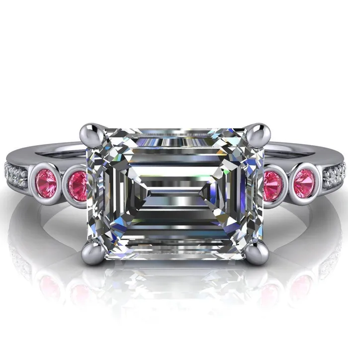 Fire Brilliance Rings Philippa Emerald Moissanite 4 Pink Sapphire Sides 4 Prong Under Bezel Multi Stone Engagement Ring
